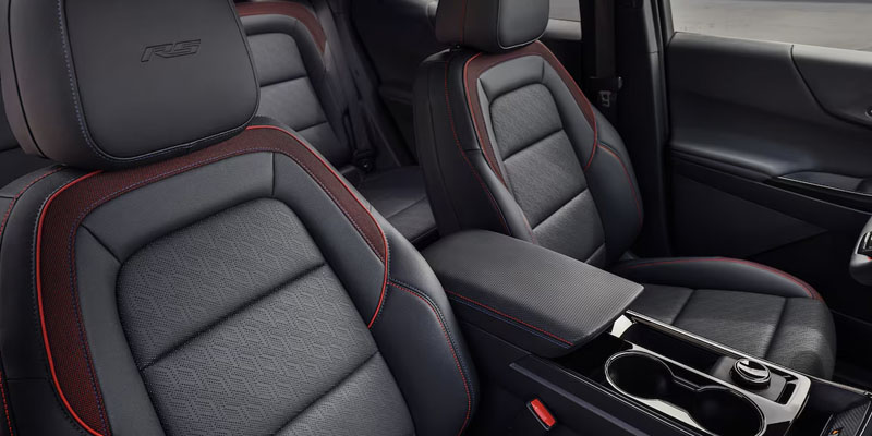 The black leather interior with red stitching in the new 2025 Chevy Equinox. - Ted Britt Chevrolet Sterling, VA